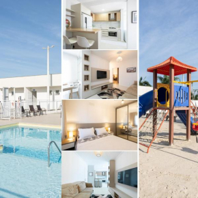 Apto a 500m da PRAIA com SACADA com CHURRASQUEIRA, WI-FI, PISCINA, PORTARIA 24h e vaga de GARAGEM